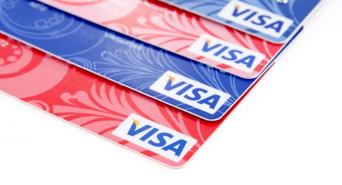 Tether и Fasset представили первую в мире карту Visa, обеспеченную золотом