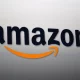 The black Amazon logo with its signature orange smile arrow on a light grey background.